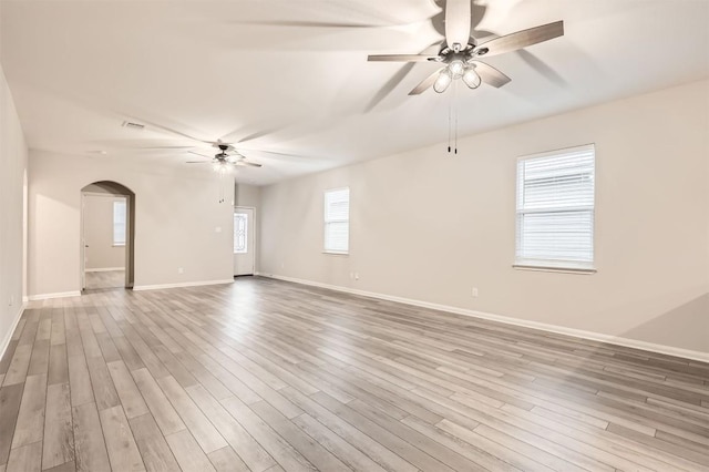 spare room featuring ceiling fan and light hardwood / wood-style flooring