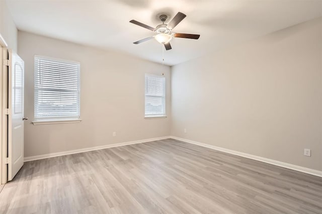 unfurnished room with ceiling fan and light wood-type flooring