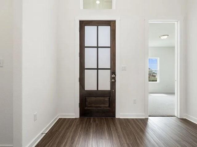 entryway with dark wood-type flooring