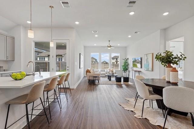 dining room featuring ceiling fan and dark hardwood / wood-style floors