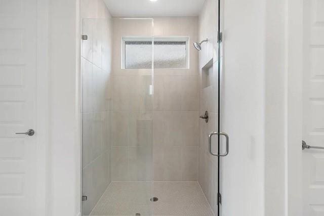 bathroom featuring an enclosed shower