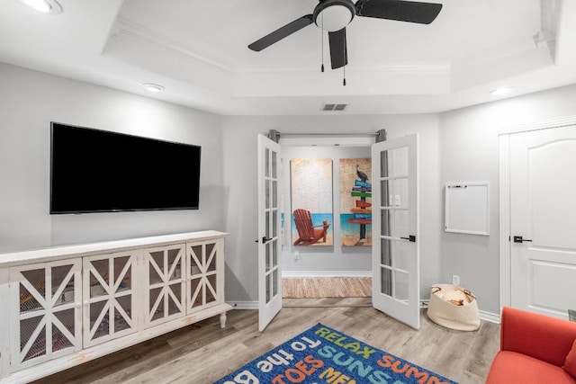 13569 Bullion Ct, Corpus Christi, TX 78418 - sitting room featuring a raised ceiling, french doors, wood finished floors, crown molding, and recessed lighting