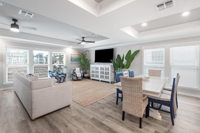 13569 Bullion Ct, Corpus Christi, TX 78418 - living room with a tray ceiling, ceiling fan, ornamental molding, light wood-type flooring, and recessed lighting