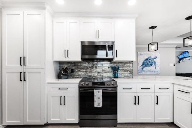 13569 Bullion Ct, Corpus Christi, TX 78418 - kitchen featuring appliances with stainless steel finishes, white cabinets, backsplash, recessed lighting, and pendant lighting
