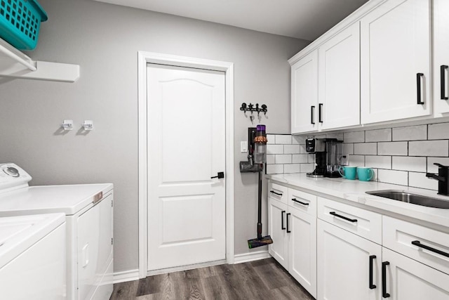 13569 Bullion Ct, Corpus Christi, TX 78418 - laundry room with washing machine and dryer, cabinet space, and dark wood-style flooring