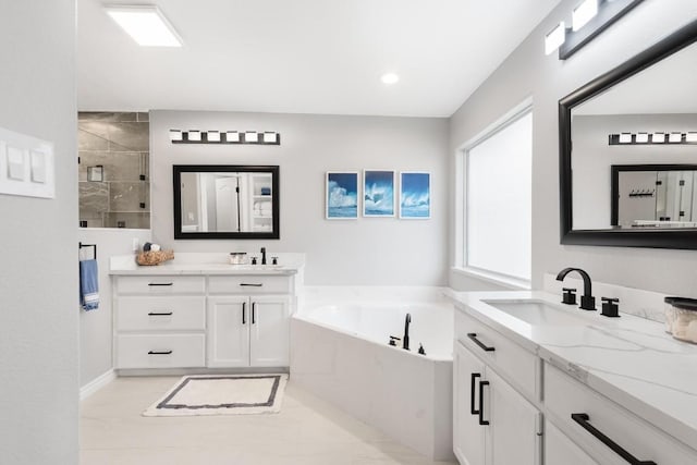 13569 Bullion Ct, Corpus Christi, TX 78418 - bathroom featuring a garden tub, two vanities, and a stall shower
