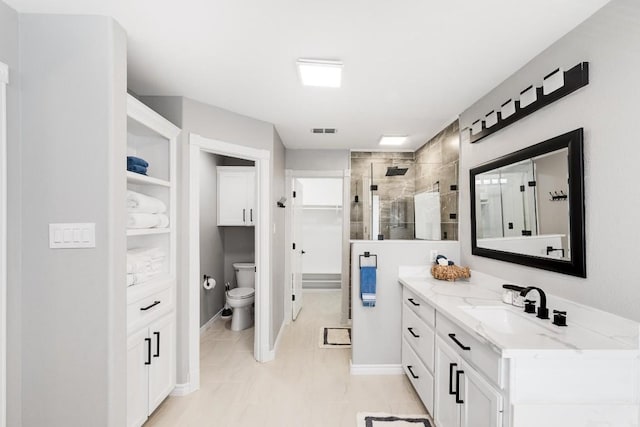 bathroom featuring walk in shower, vanity, and toilet