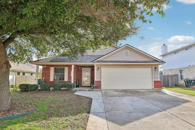 view of front of home with concrete driveway, brick siding, and fence