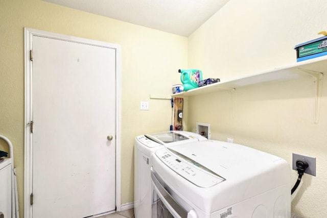 laundry room featuring laundry area and washing machine and dryer