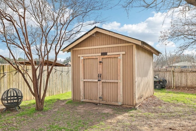 view of shed with a fenced backyard