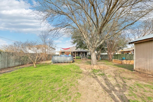 view of yard with a fenced backyard and a fenced in pool