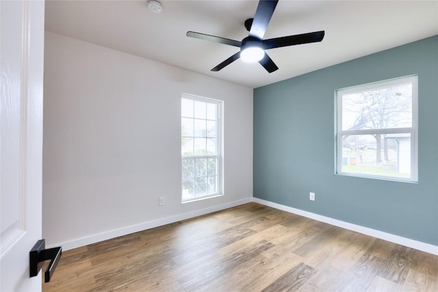 unfurnished room with light wood-type flooring and ceiling fan