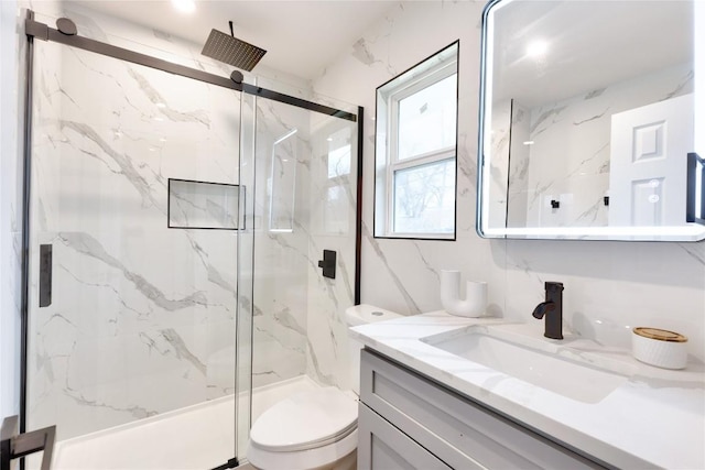 bathroom with vanity, toilet, and walk in shower