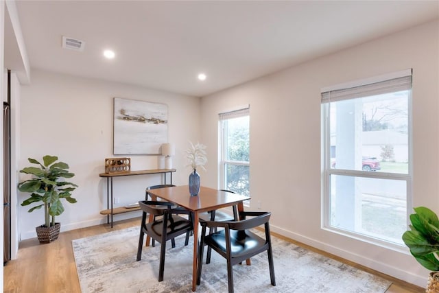 dining room with light hardwood / wood-style flooring