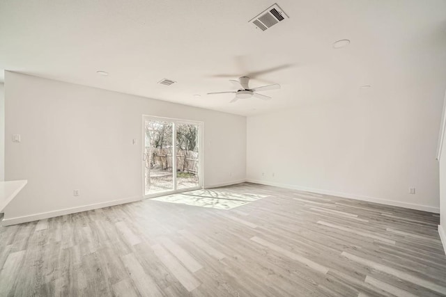 spare room featuring ceiling fan and light hardwood / wood-style floors