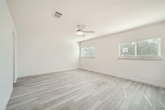 unfurnished room with ceiling fan and light wood-type flooring