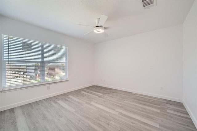 unfurnished room with ceiling fan and light wood-type flooring