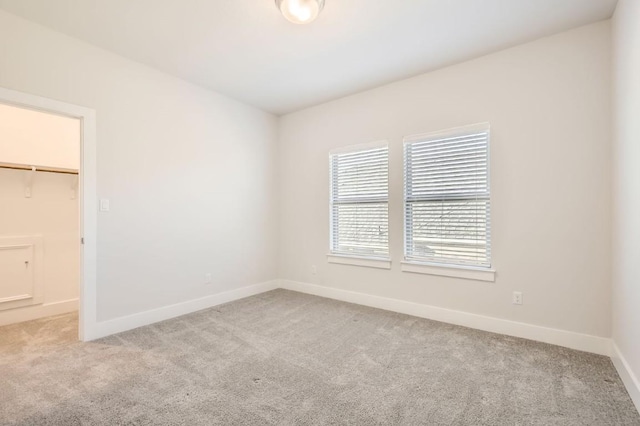 spare room with light carpet