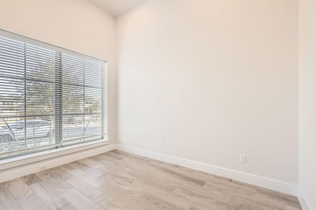 155 Cyrus Milton Dr, Buda, TX 78610 - unfurnished room featuring healthy amount of natural light, baseboards, and light wood-style flooring