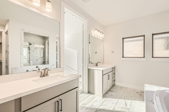 bathroom with vanity and separate shower and tub