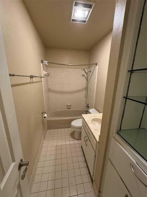 full bathroom featuring vanity, shower / tub combination, tile patterned floors, and toilet