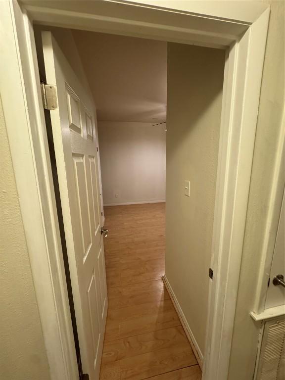 hall with light hardwood / wood-style floors