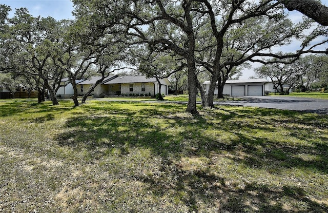 view of yard featuring a garage