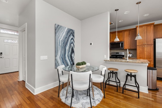 dining room with light hardwood / wood-style flooring