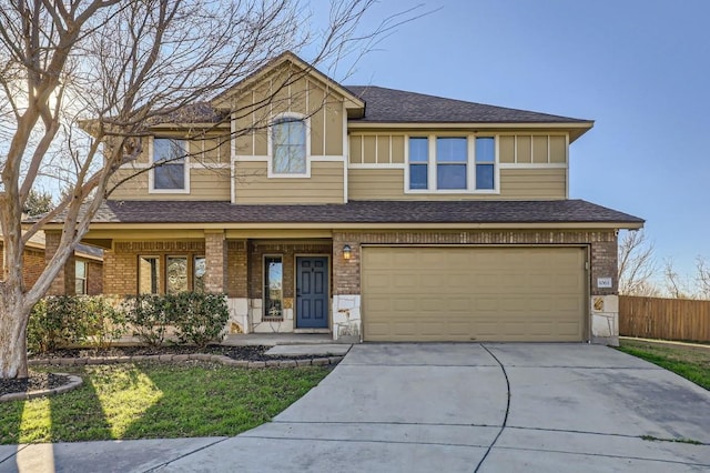 view of front of property featuring a garage and a porch