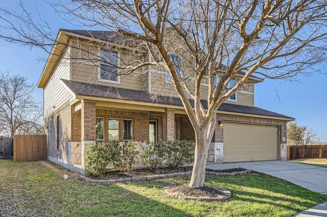 view of front facade featuring a garage and a front yard