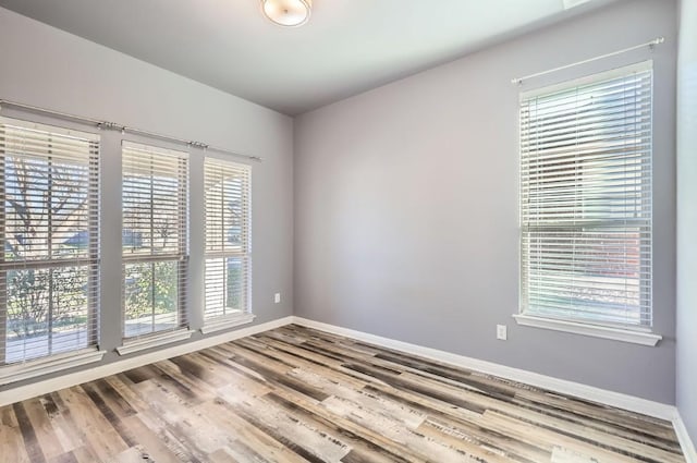 spare room featuring hardwood / wood-style floors