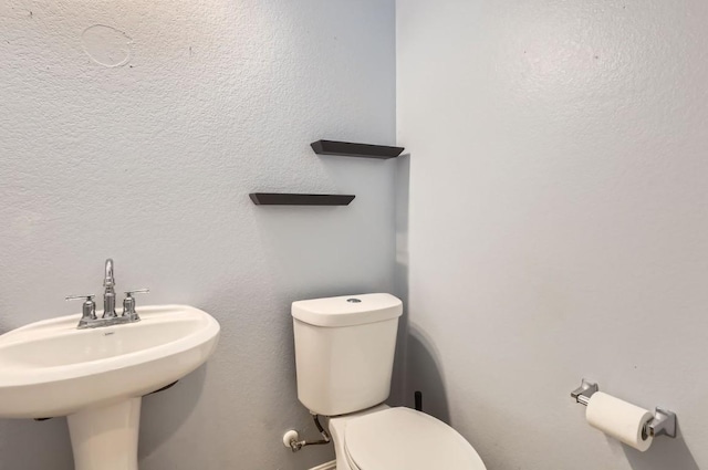 bathroom with sink and toilet