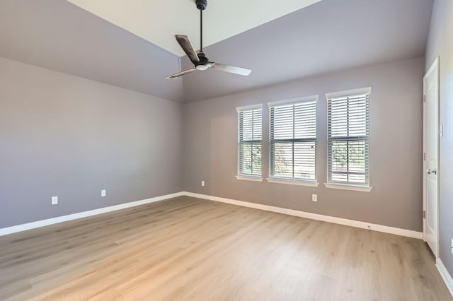 unfurnished room featuring lofted ceiling, ceiling fan, and light hardwood / wood-style floors