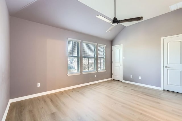 unfurnished bedroom featuring vaulted ceiling, ceiling fan, and light hardwood / wood-style flooring