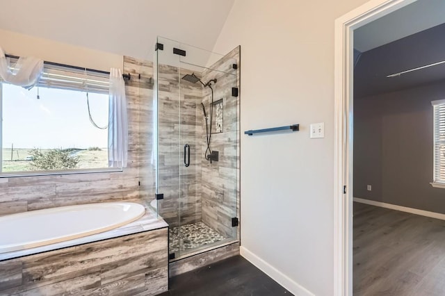 bathroom featuring hardwood / wood-style floors and shower with separate bathtub