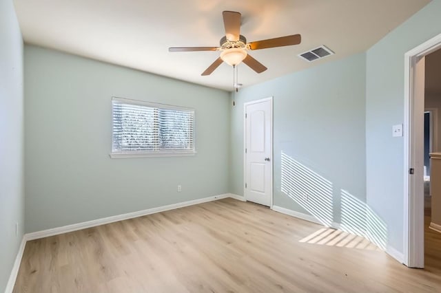 unfurnished room featuring ceiling fan and light wood-type flooring