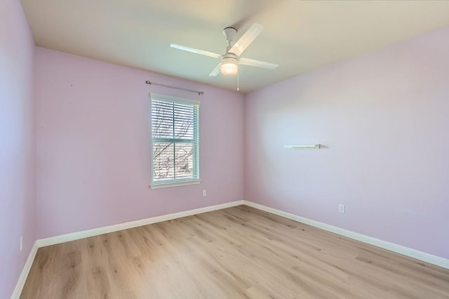 empty room with ceiling fan and light wood-type flooring