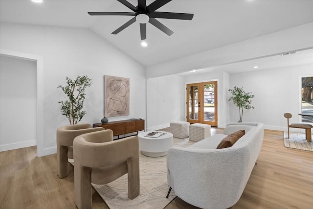 living room featuring french doors, ceiling fan, lofted ceiling, and light hardwood / wood-style floors