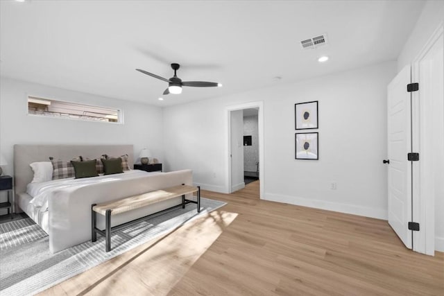 bedroom featuring ceiling fan and light hardwood / wood-style floors