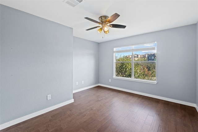 unfurnished room featuring ceiling fan and dark hardwood / wood-style flooring