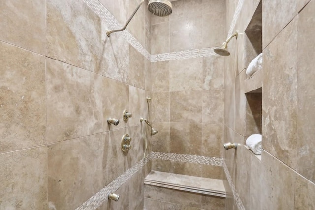 bathroom with tiled shower