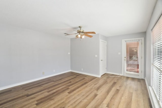 unfurnished room with ceiling fan and light hardwood / wood-style floors