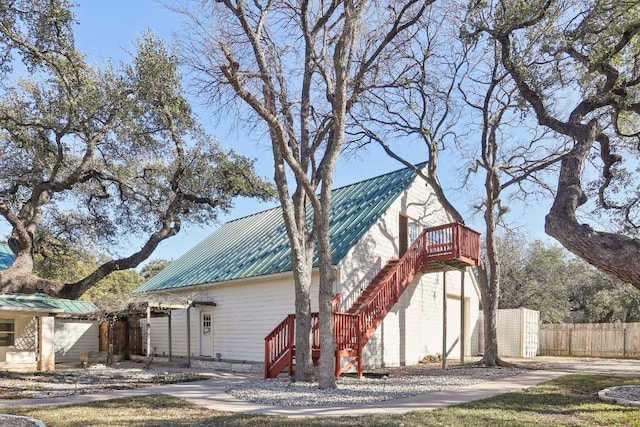 view of front of home featuring a storage unit