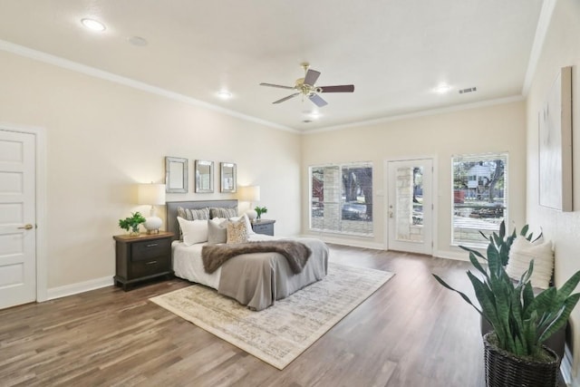 bedroom featuring access to exterior, ornamental molding, dark hardwood / wood-style floors, and ceiling fan