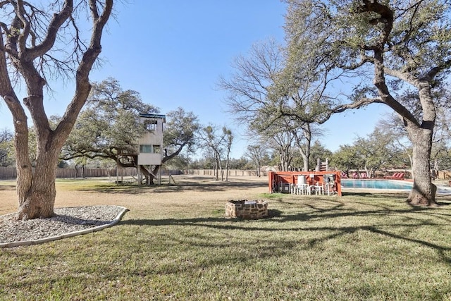 view of yard with a fenced in pool