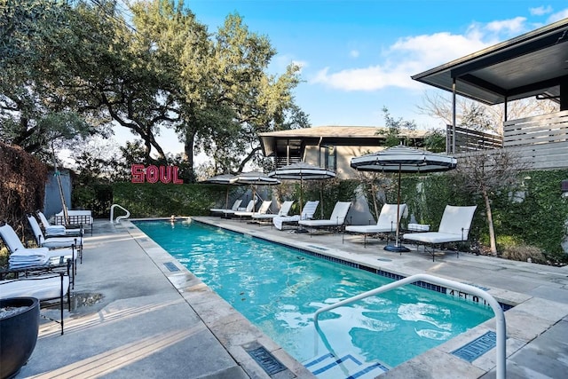 view of swimming pool featuring a patio area