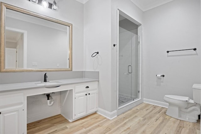 bathroom with an enclosed shower, hardwood / wood-style floors, vanity, and toilet