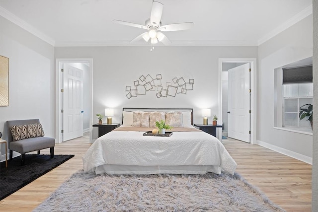 bedroom with ornamental molding, hardwood / wood-style floors, and ceiling fan