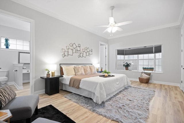 bedroom with multiple windows, ornamental molding, and light hardwood / wood-style floors