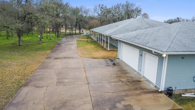 exterior space featuring a yard and a garage